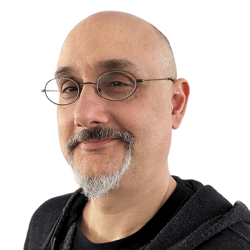 Hochwertiger Mann mit Brille und Bart, lächelnd, professionell und freundlich.